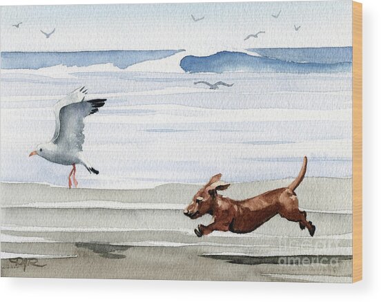 Dog Chasing Seagull on Beach Wood Print