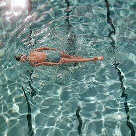 A Woman Swimming In A Pool by Fred Lyon
