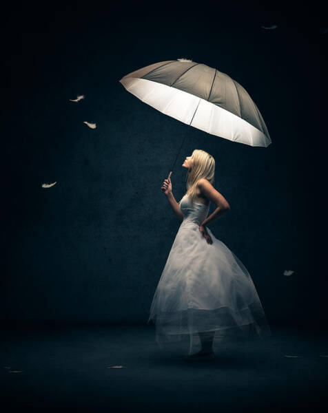 Woman Holding Umbrella with Floating Feathers Art Print